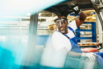 man operating forklift