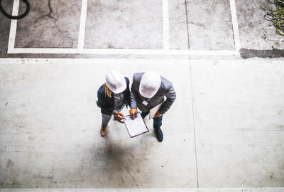 top view of two engineers with clipboard